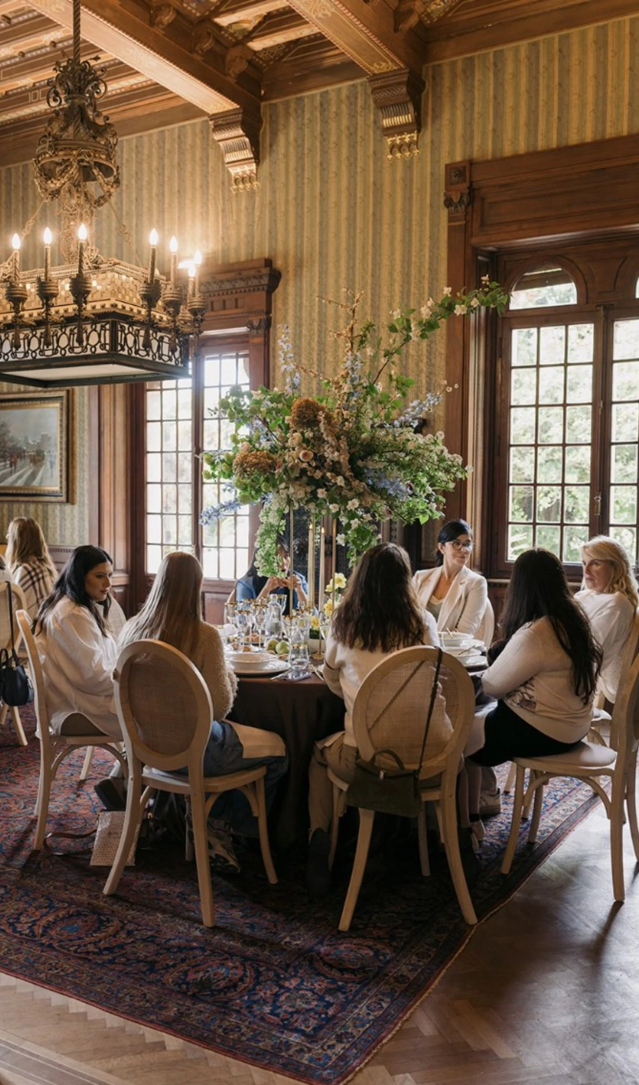 Guests at dinner in the wooden room