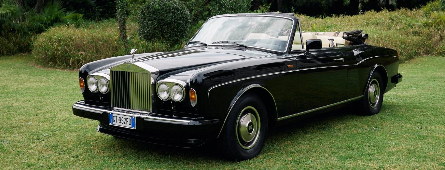 Black Rolls-Royce Corniche convertible on the villa lawn