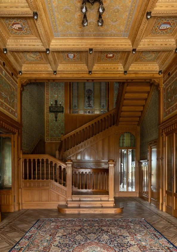Grand foyer with wooden staircase